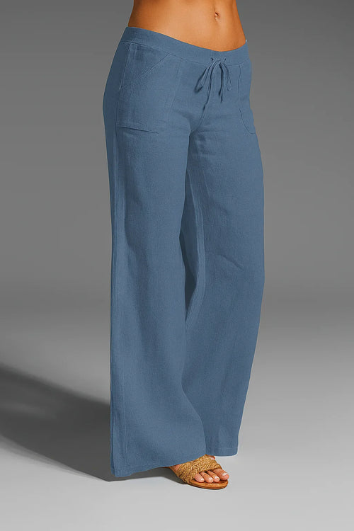 Model wearing wide-leg white linen trousers – ELEGENZE