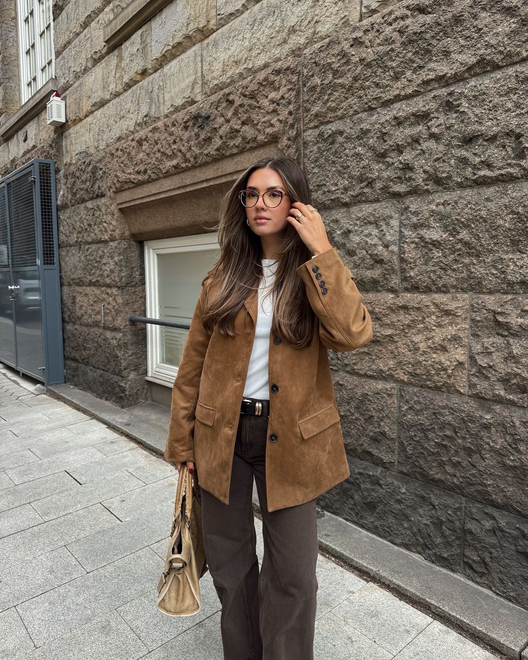 Model wearing long wool blend coat in warm brown – ELEGENZE
