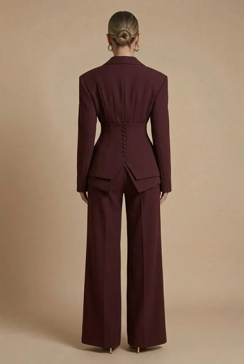 Model wearing wide-leg peaked lapel tailored suit in burgundy – ELEGENZE